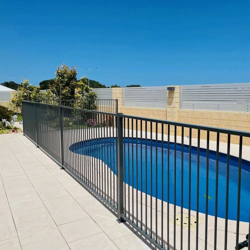 Grey powder-coated aluminium pool fencing around a round pool